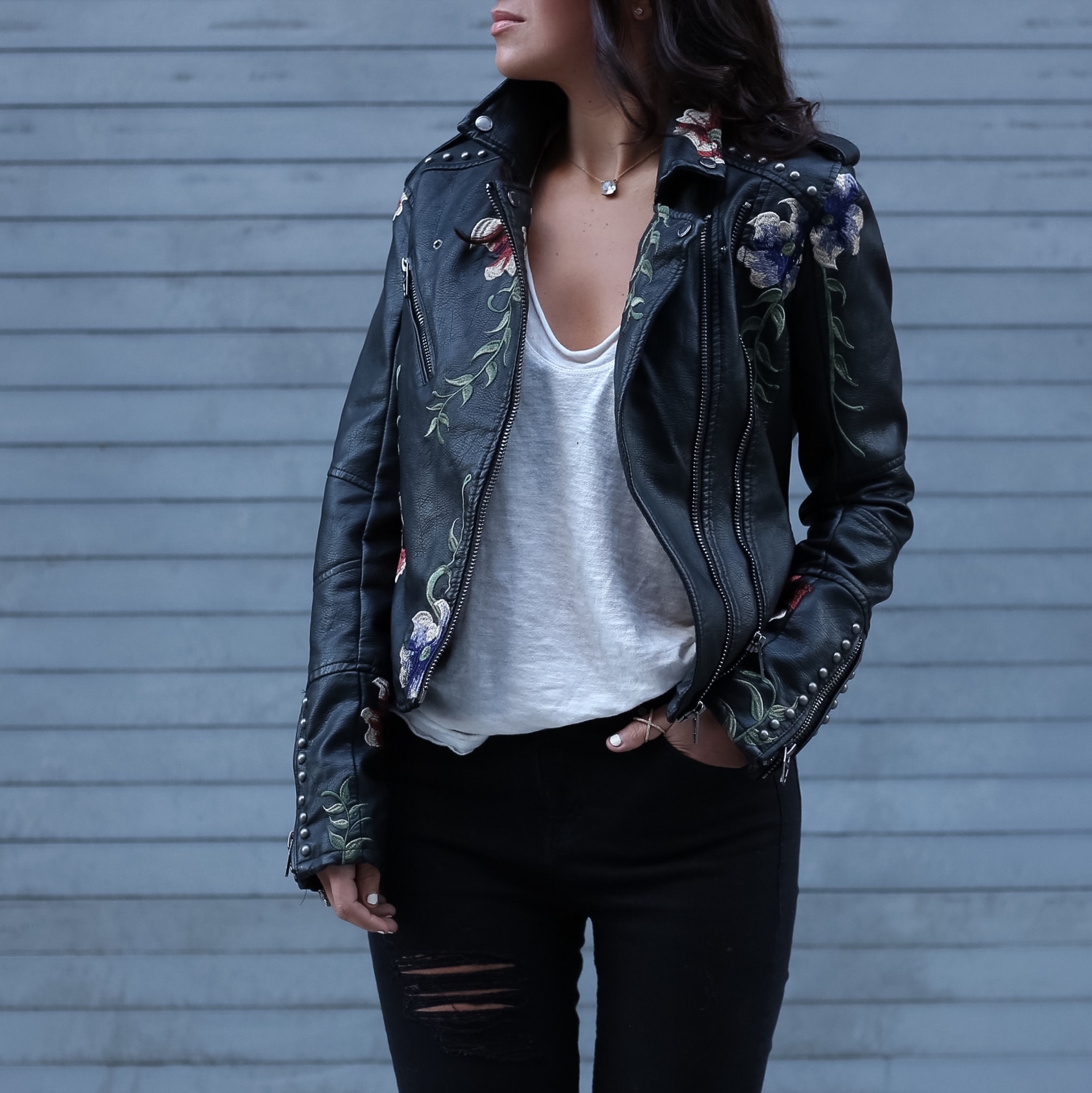 Blogger Sarah Lindner of The House of Sequins wearing BlankNYC Embroidered Faux Leather Moto Jacket and free people bombay tank