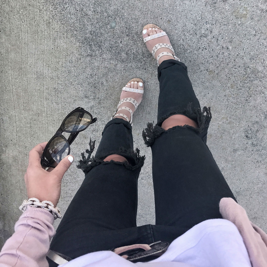Blogger Sarah Lindner of The House of Sequins wearing one teaspoon jeans and white free people tank top for spring talking about Mercury In Retrograde.
