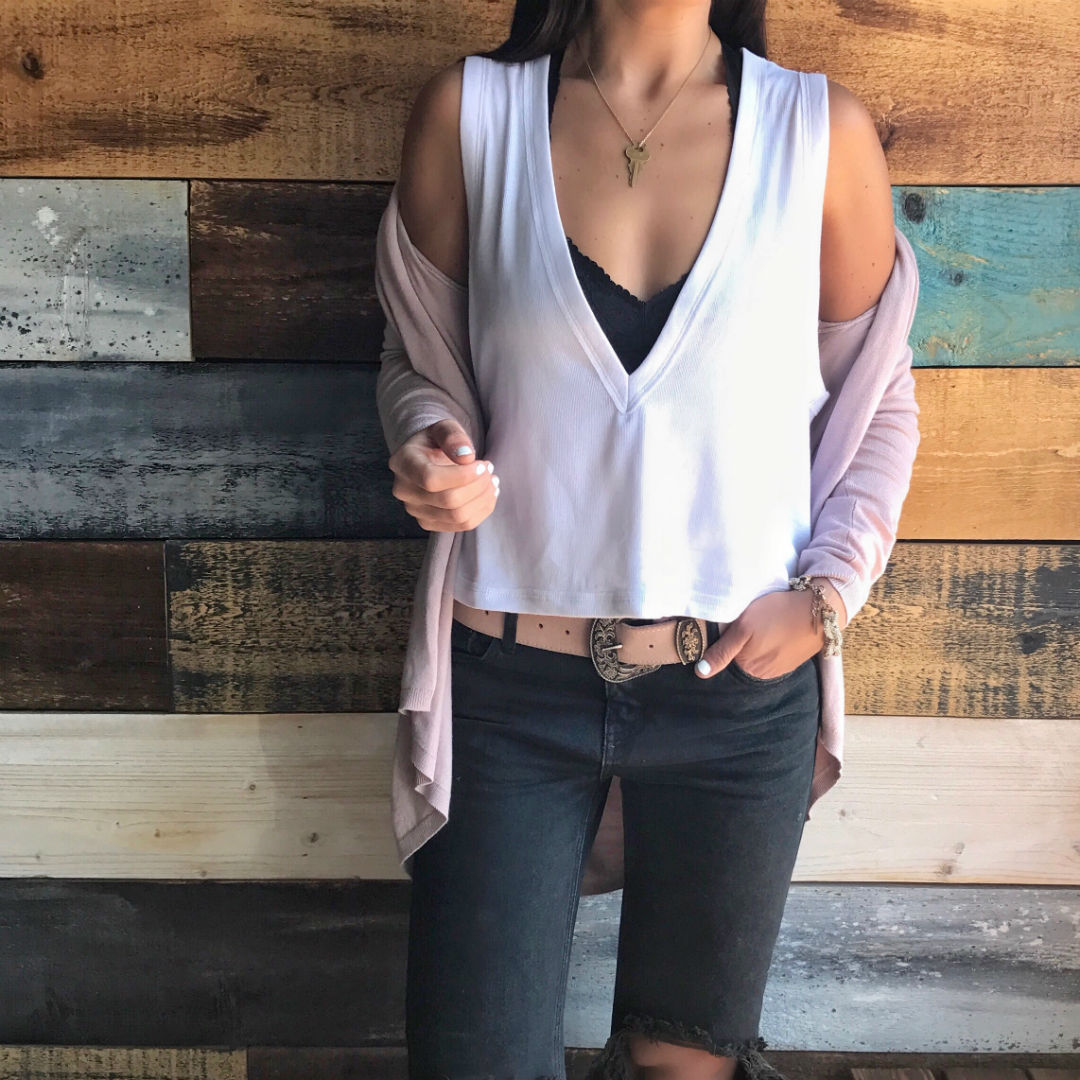 Blogger Sarah Lindner of The House of Sequins wearing one teaspoon jeans and white free people tank top for spring talking about Mercury In Retrograde.