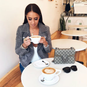Blogger Sarah Lindner wearing blanknyc gray moto jacket at southdown coffee - oyster bay