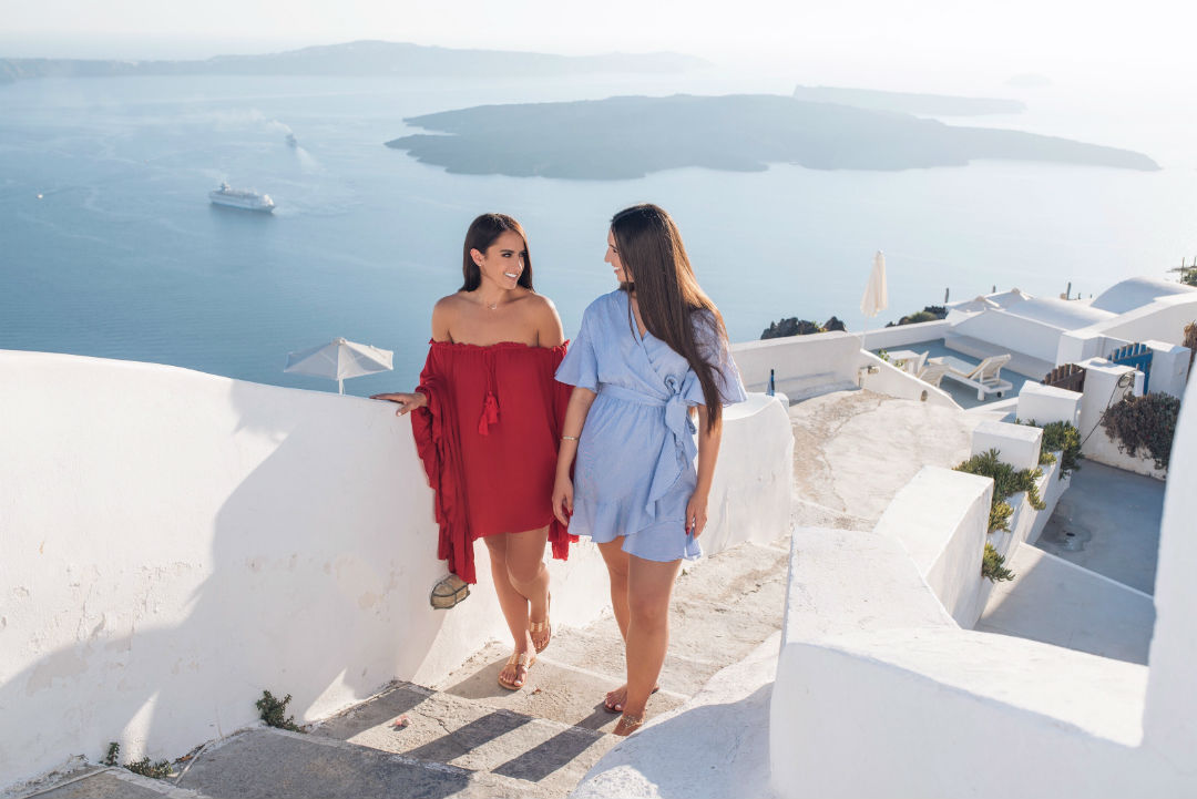 Blogger Sarah Lindner of The House of Sequins in Santorini Greece wearing Free People Here To Stay Tunic Dress in Red. What to wear in Santorini Greece