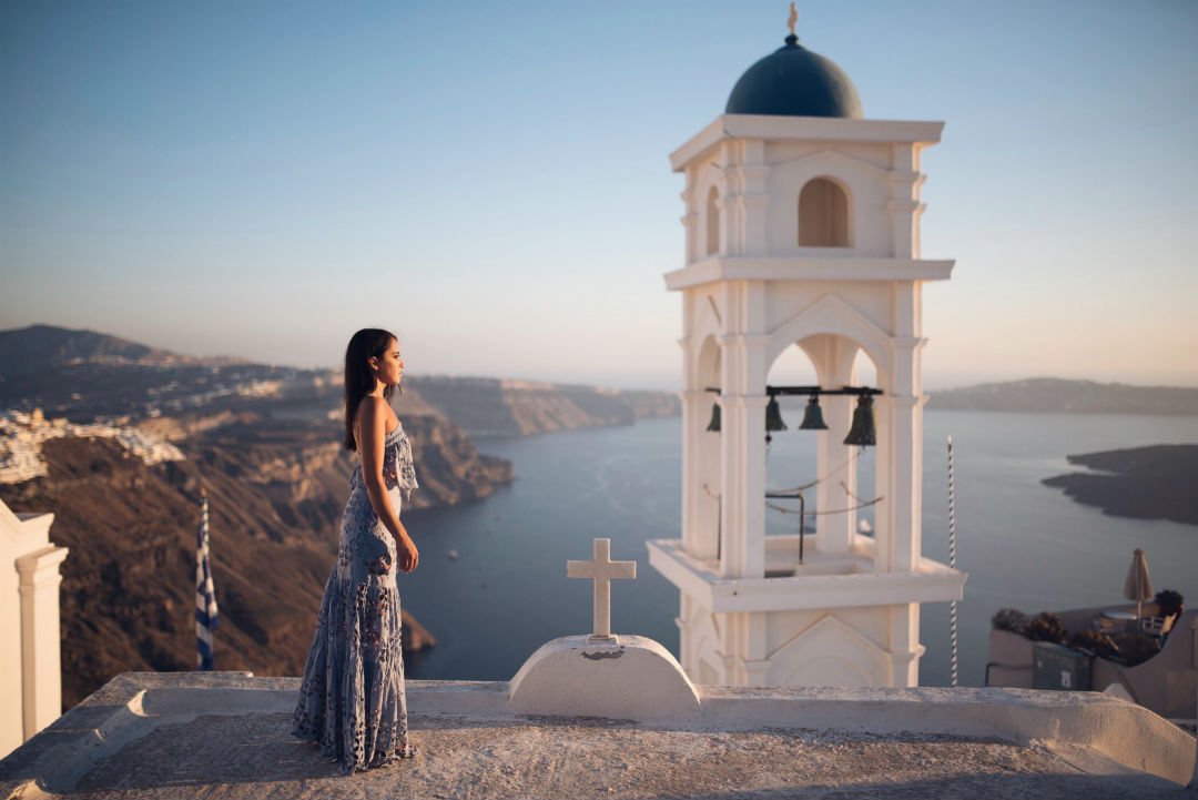 Blogger Sarah Lindner of The House of Sequins in Santorini Greece wearing Free People Here To Stay Tunic Dress in Red. What to wear in Santorini Greece