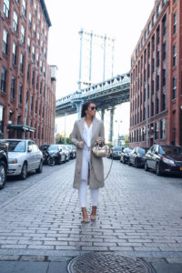 Blogger Sarah Lindner of The House of Sequins wearing white skinny jeans in winter
