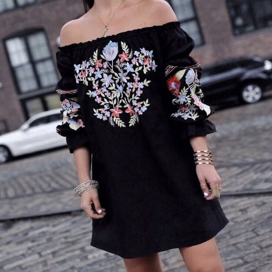 Blogger Sarah Lindner of The House of sequins wearing free people tunic dress