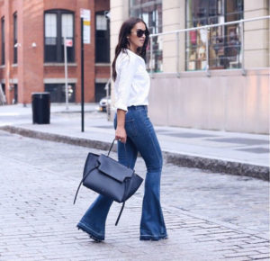 Blogger Sarah Lindner of The House of Sequins wearing celine mini belt bag and express flare bell bottom jeans