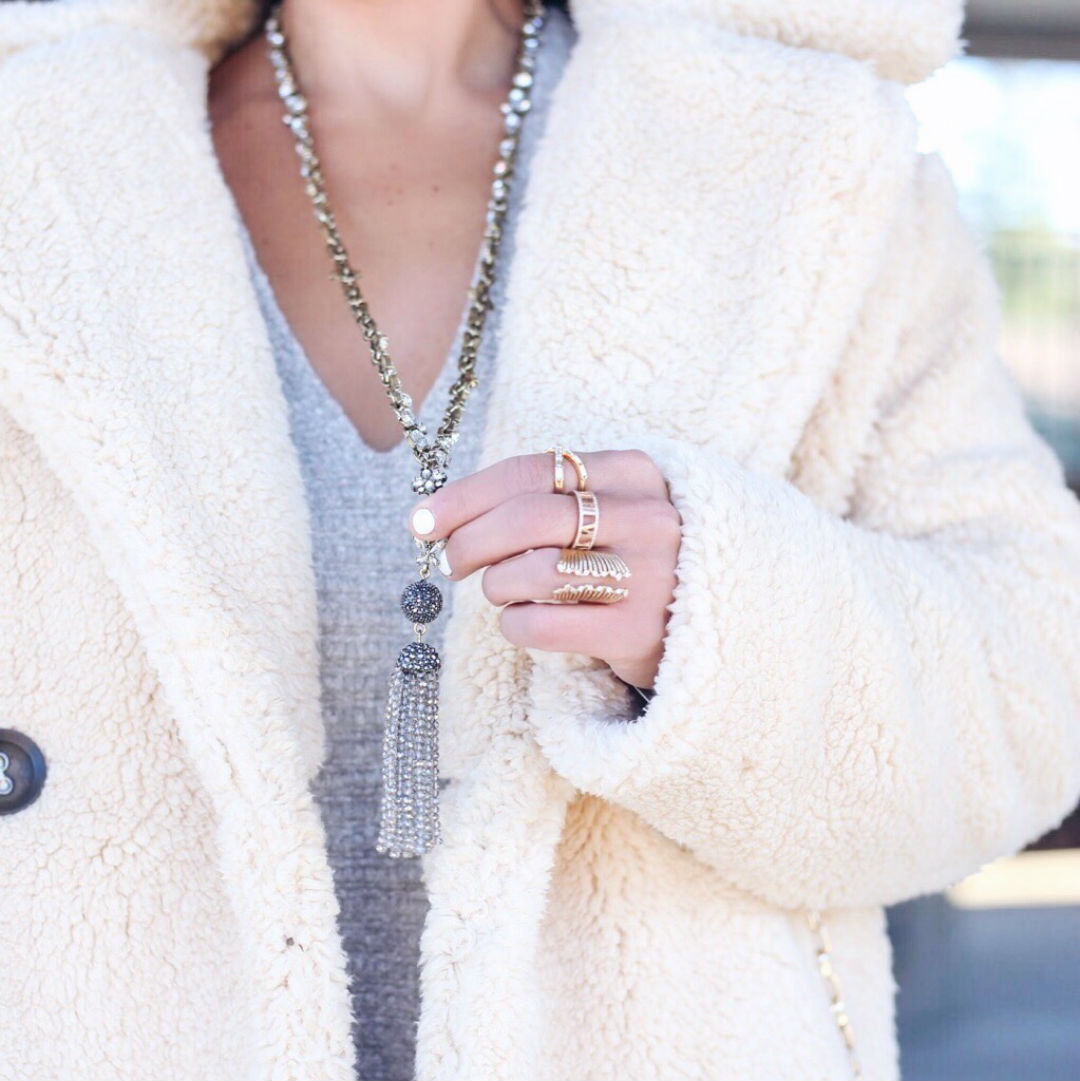 Blogger Sarah Lindner of The House of sequins wearing free people Teddy Peacoat and free people Happy Trails Pom Beanie