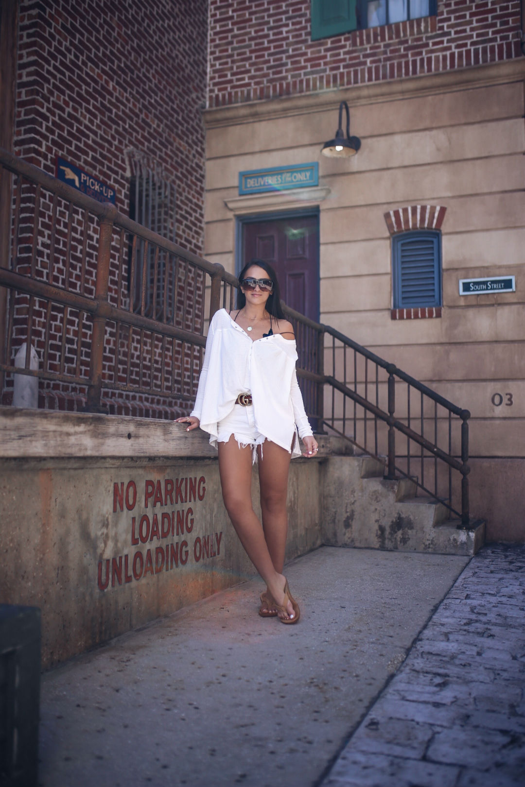 Blogger Sarah Lindner of The House of Sequins wearing We the Free Kai Henley FREE PEOPLE and free people Loving Good Vibrations Cutoff Denim Shorts