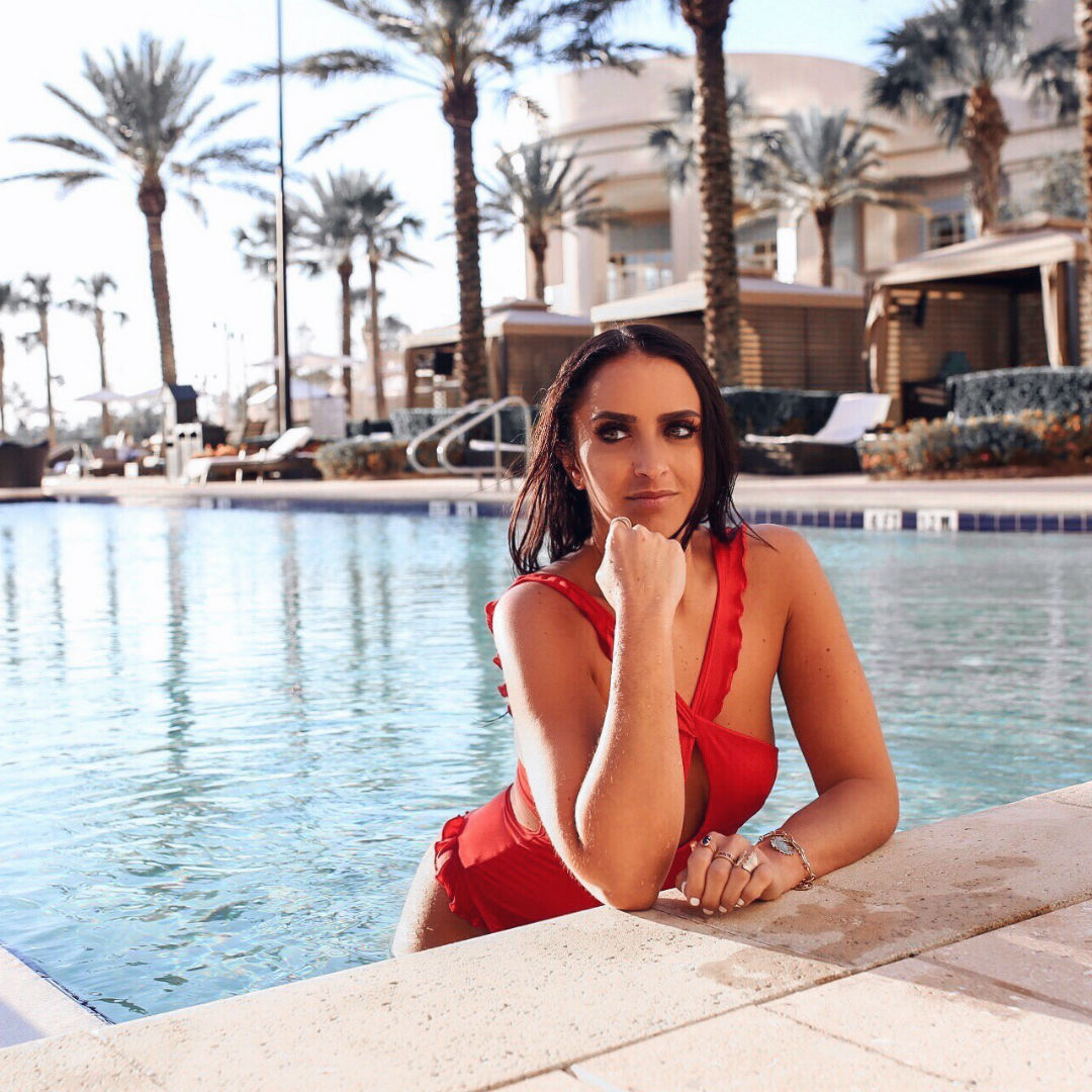 Blogger Sarah Lindner of the house of sequins wearing for love and lemons red Rodeo Keyhole One-Piece Swimsuit