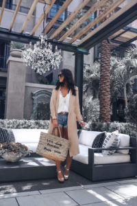 Blogger Sarah Lindner of The House of Sequins wearing 1 state trench coat and Loving Good Vibrations Shorts by Free People