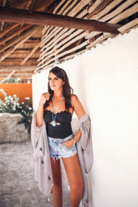 Blogger Sarah Lindner of the house of sequins wearing Chelsea28 and it is their Scallop Bandeau One-Piece Swimsuit, One teaspoon bandit shorts. Kendra Scott Beatrix Pendant Necklace and Seven Seas Patchwork Print Kimono by Free People