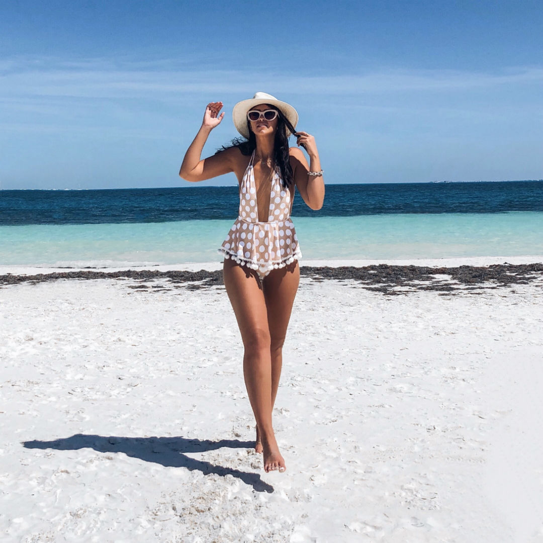 Blogger Sarah Lindner of The House of Sequins wearing Pompom One-Piece Swimsuit from Montce and Rip Curl Oasis Caridgan. Best one piece swimsuit to wear on vacation
