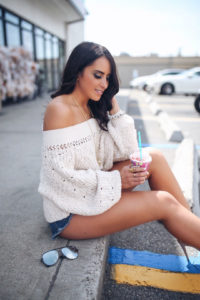 Blogger Sarah Lindner of the house of sequins wearing Free People Pandora’s Boatneck Sweater. Instagram roundup on what to wear to 7-11. How to style a off the shoulder sweater