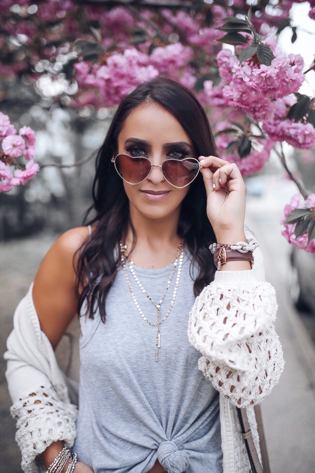 Blogger Sarah Lindner of The House of Sequins wearing Free people gray tank top. Marc Fisher wedges. Baublebar layered necklace. Heart sunglasses. Sole Society bag