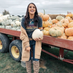 Blogger Sarah Lindner of The House of Sequins wearing Fall Favorites Graphic T- Shirt from Target, Charles by Charles David, and they are the Holly Wedge Boot and Free People Phantom Cardigan. What to wear apple picking.