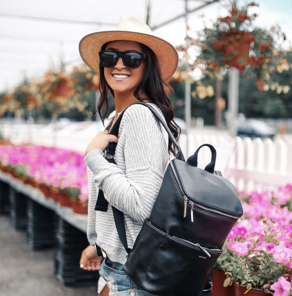 Blogger Sarah Lindner of The House of Sequins wearing Matt & Nat Backpack and Henley Sweater at Abercrombie & Fitch