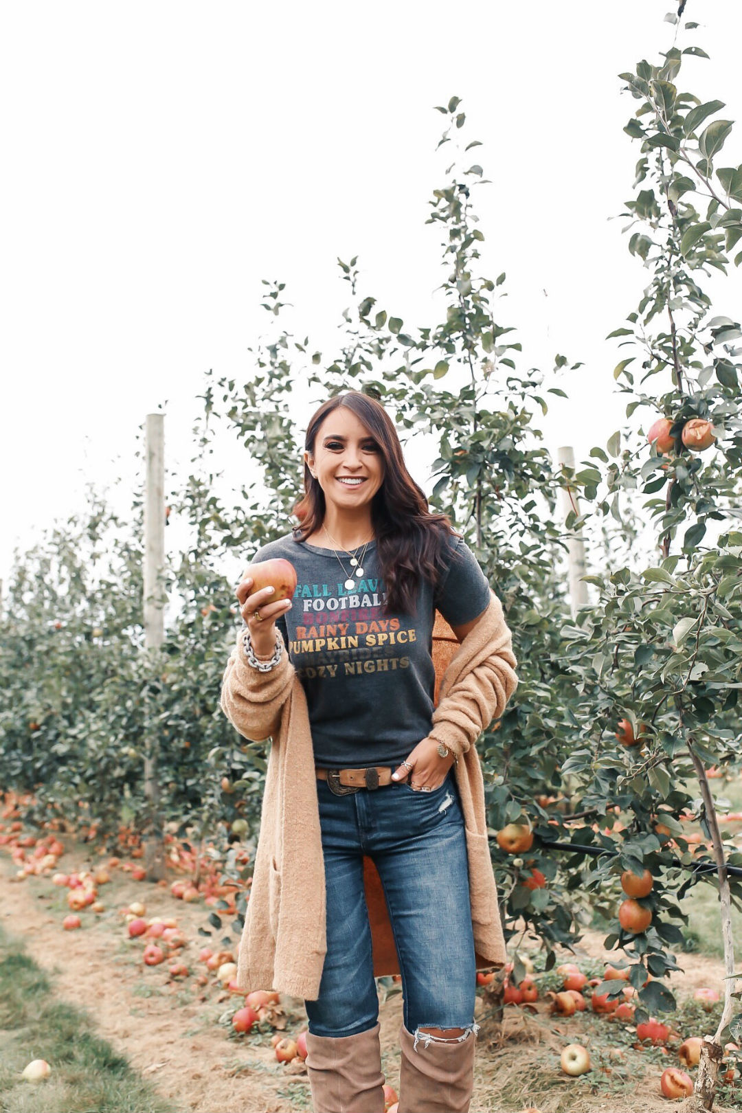 Blogger Sarah Lindner of The House of Sequins wearing Fall Favorites Graphic T- Shirt from Target, Charles by Charles David, and they are the Holly Wedge Boot and Free People Phantom Cardigan. What to wear apple picking.