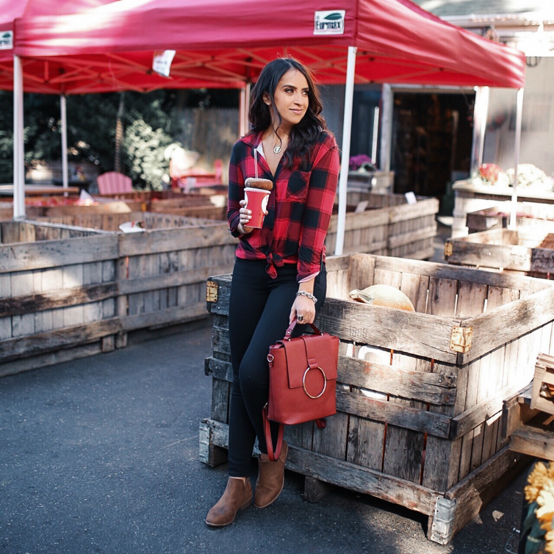 blogger Sarah Lindner of The House of Sequins wearing black Levi’s 711 Skinny Jeans and Plaid Tie Front Elbow Sleeve Blouse from Walmart. What to wear to a farmers market.
