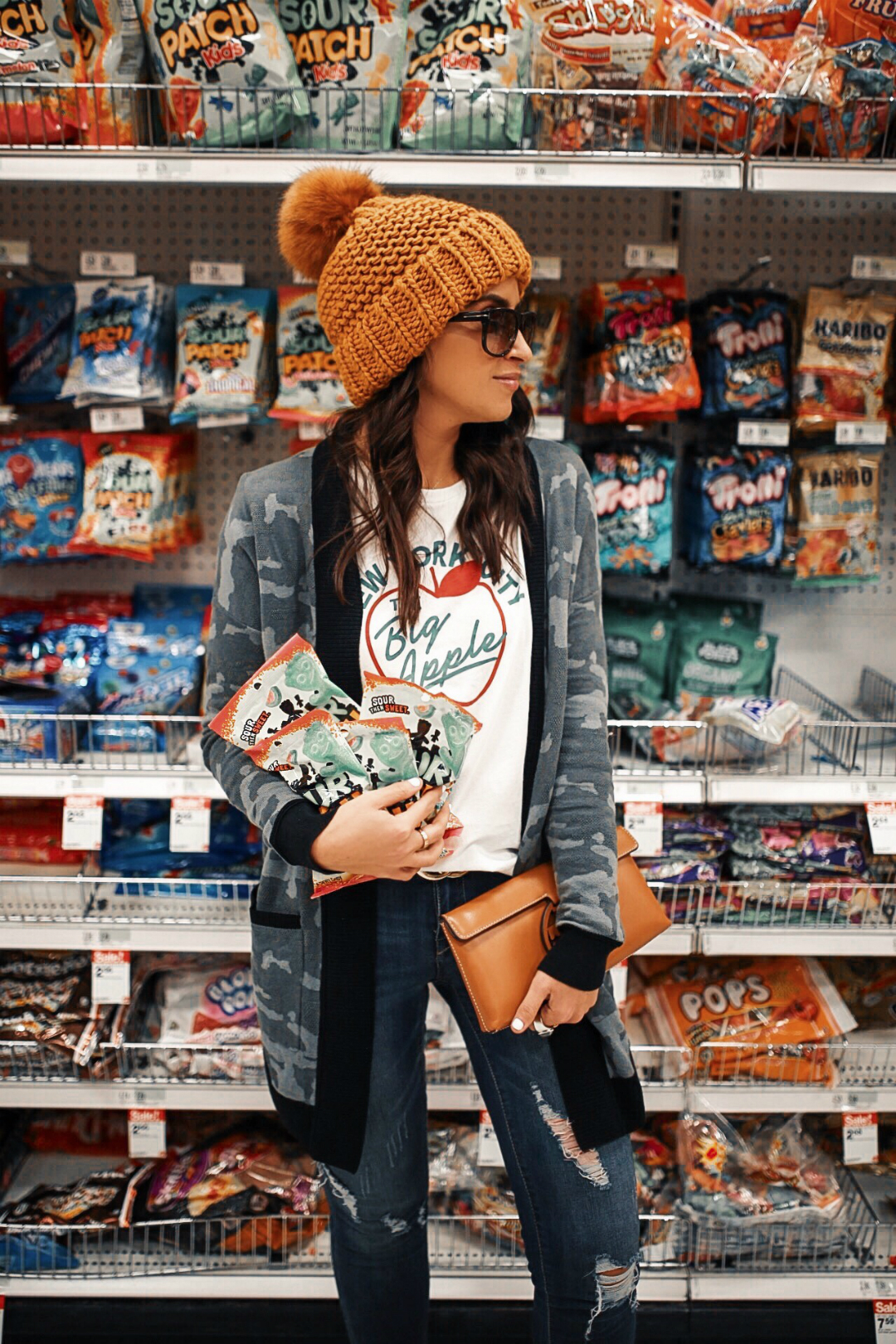 Blogger Sarah Lindner of The House of Sequins wearing Big Apple Tee by Free People, 1822 Decon Distressed Skinny Jeans, Camo Cardigan Cover-Up from Express, Steve Madden makes their Feather L Genuine Calf Hair Loafer Flat, and tory burch miller clutch. What to wear while target shopping. 