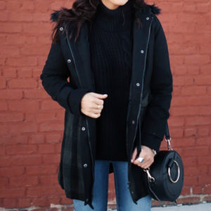 Blogger Sarah Lindner of The House of Sequins wearing Jason Maxwell Long Faux Wool Jacket with a Hood, Metallic Sky Crossbody, Time And Tru Hiker Boots in black, and Poof! Cable Knit Turtle Neck Long Sleeve Sweater