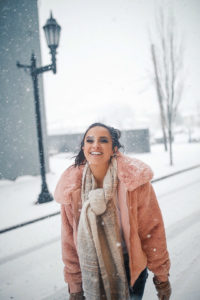 Blogger Sarah Lindner of The House of Sequins wearing BlankNYC Faux Fur Jacket in blush, Stuart Weitzman and they are the Tie-model Over The Knee Stretch boots, Abercrombie & Fitch Cozy Scarf. What to wear on a snow day