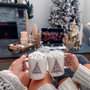 Blogger Sarah Lindner of The House of Sequins wearing UGG Cable Knit Over The Knee Socks. Harry Potter Christmas scene. How to decorate for Christmas.