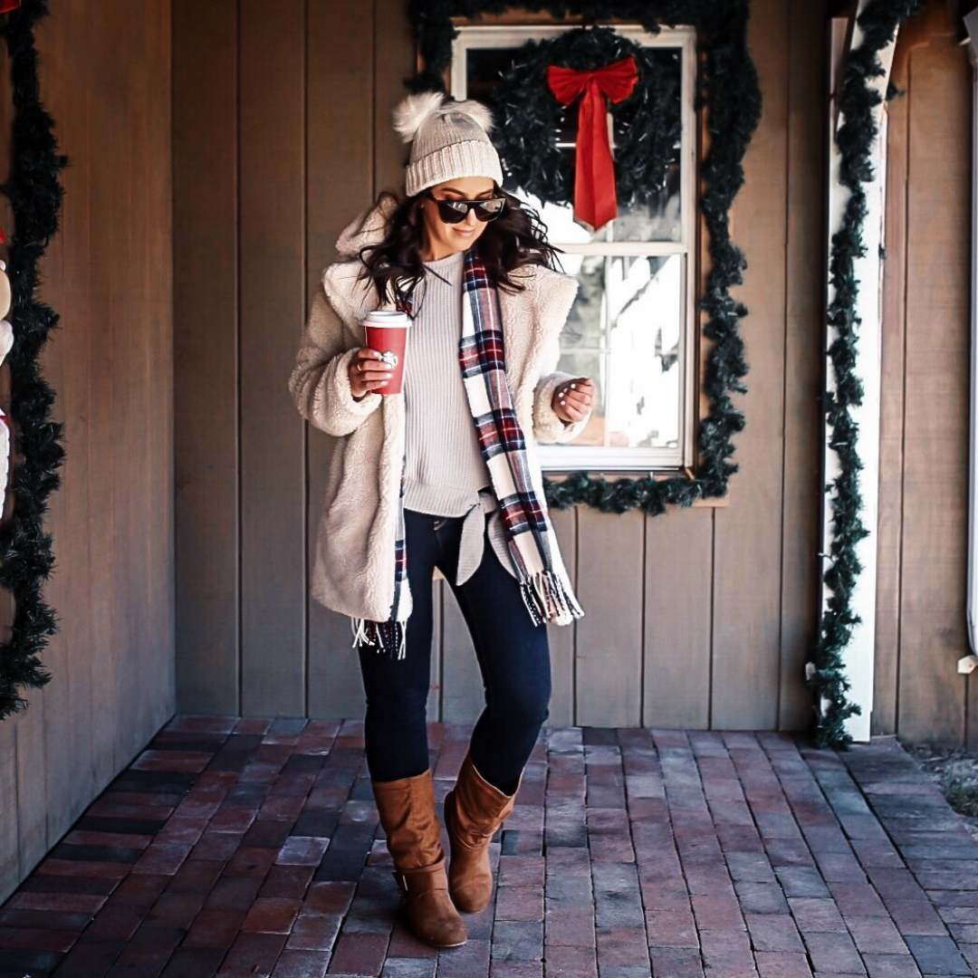 ​Blogger Sarah Lindner of The House of Sequins wearing Tru Self Women’s Long Sleeve Side Knot Thermal, EV1 from Ellen DeGeneres Charlotte High Rise Jeggings, and Brinley Co. Slouchy Side Accent Buckle Boots. What to Wear To A Casual Holiday Party​ under $50