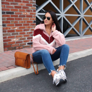 Blogger Sarah lindner of the house of sequins wearing Abercrombie & Fitch Colorblock Sherpa Half-Zip Sweatshirt, Abercrombie & Fitch High-Rise Ankle Jeans, Abercrombie & Fitch Leather Satchel, and New Balance 574