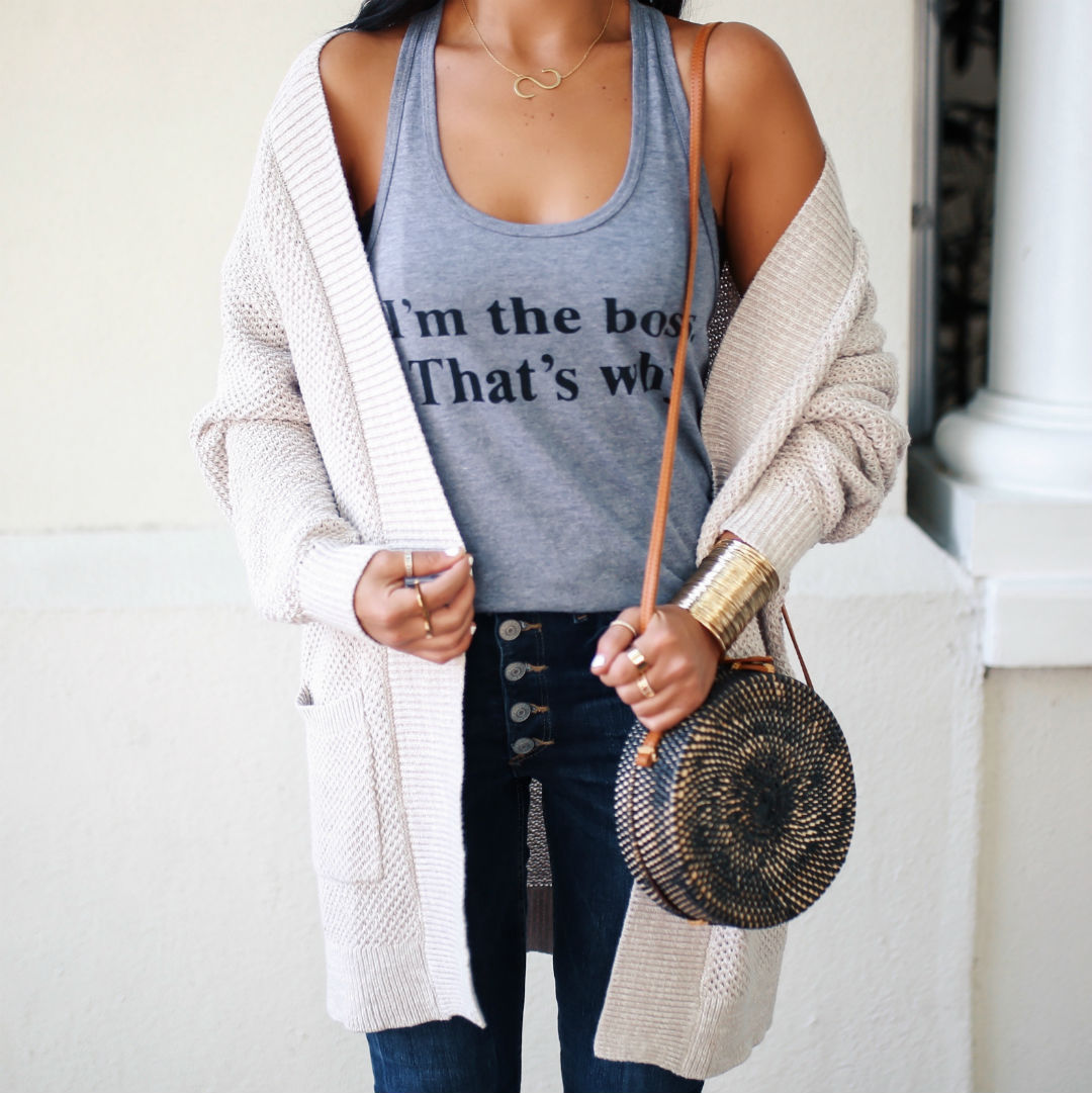 Blogger Sarah Lindner of The House of Sequins wearing Express I’m The Boss, That’s Why graphic tank with High Waisted Button Fly Cropped Jean Leggings and Open Front Wedge Cardigan.