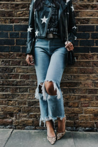 Blogger Sarah Lindner of The House of Sequins wearing Blank Denim Star Print Vegan Moto Jacket, Daisie Pointy-Toe Genuine Calf Hair Pump, Free People Maggie Mid-Rise Straight Leg Jeans