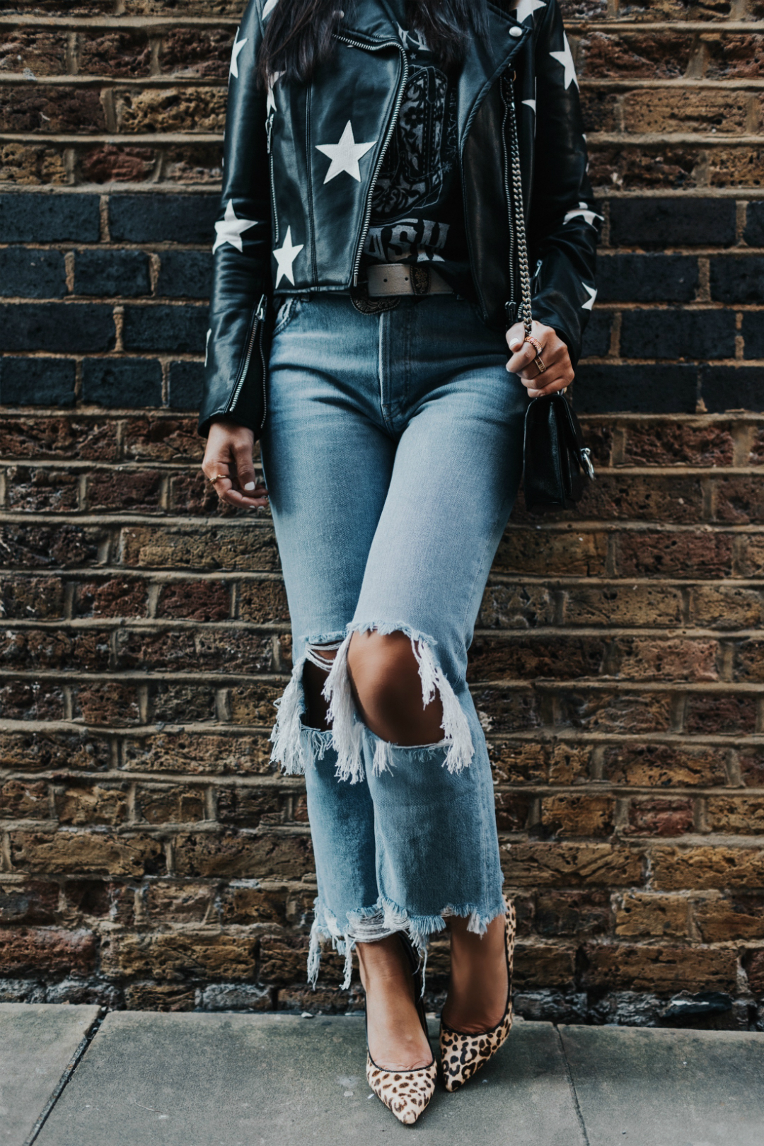 Blogger Sarah Lindner of The House of Sequins wearing Blank Denim Star Print Vegan Moto Jacket, Daisie Pointy-Toe Genuine Calf Hair Pump, Free People Maggie Mid-Rise Straight Leg Jeans