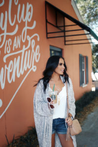 Blogger Sarah Lindner of The House of Sequins wearing a free people cardigan, lace trim camisole and gucci soho disco bag