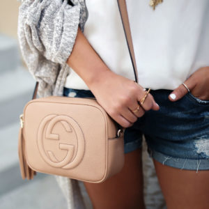 Blogger Sarah Lindner of The House of Sequins wearing a free people cardigan, lace trim camisole and gucci soho disco bag