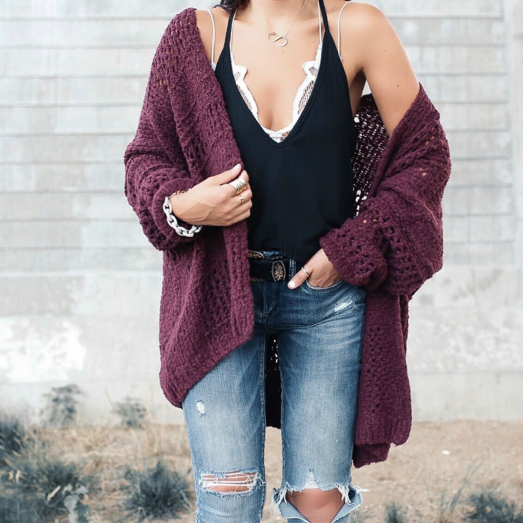 Blogger, Sarah Lindner of The House Of Sequins wearing a free people slinky cami, with ripped jeans and a cardigan