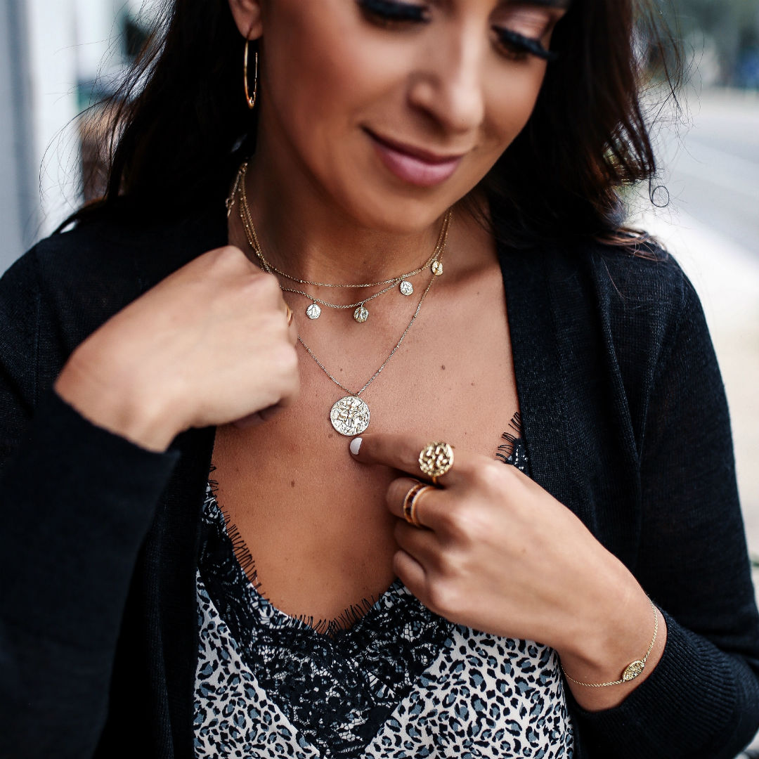 Blogger, Sarah Lindner of The House Of Sequins wearing a lace cami and a black cardigan