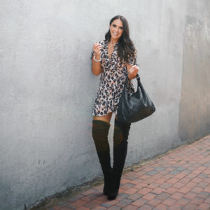 Blogger Sarah Lindner of The House of Sequins wearing J.ING Wildcat Leopard Print Dress, Black over the knee boots and black bottega Veneta bag