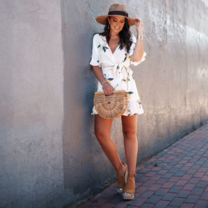 Blogger, Sarah Lindner of The House Of Sequins wearing a rails wrap skirt and wrap top with a lemon print