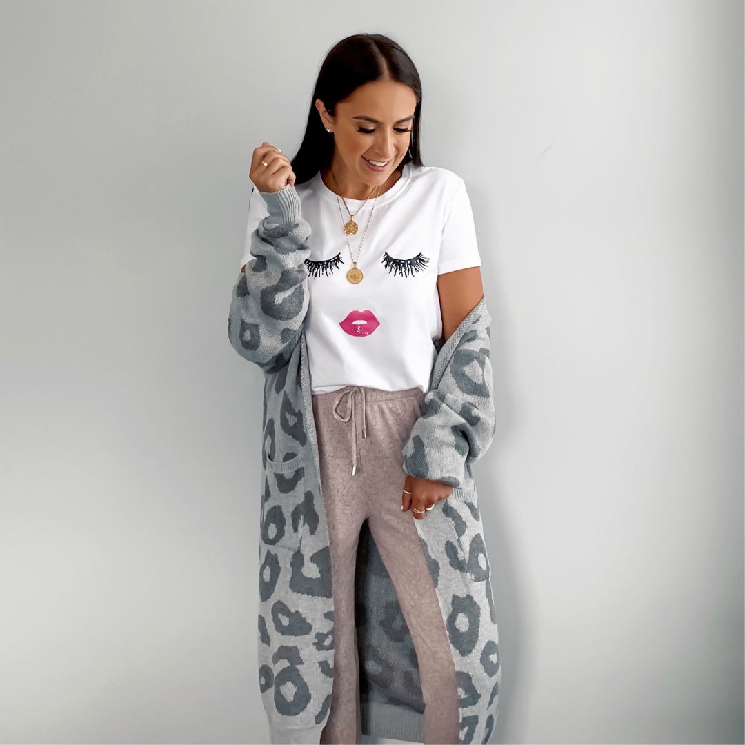 Blogger Sarah Lindner of The House of Sequins wearing gray leopard cardigan from amazon, amazon prime joggers and graphic tee from amazon prime