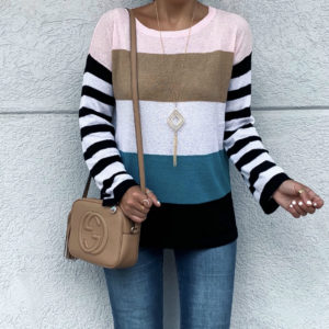 Blogger Sarah Lindner of the house of sequins wearing amazon stripe sweater and levi's distressed jeans