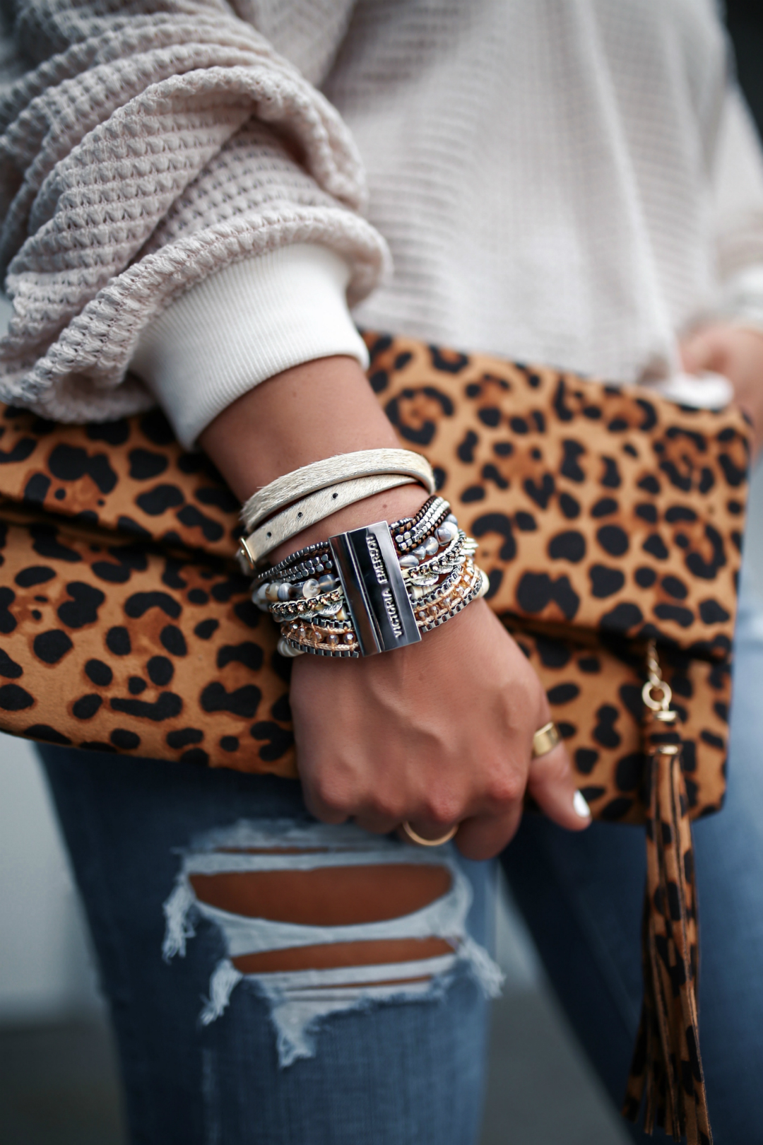 Blogger Sarah Lindner of The House of Sequins wearing Victoria Emerson double wrap bracelets, leopard clutch, amazon waffle knit sweater