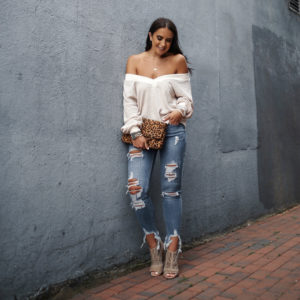 Blogger Sarah Lindner of The House of Sequins wearing Victoria Emerson wrap bracelet, leopard clutch, amazon waffle knit sweater, express distressed jeans