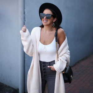 Blogger Sarah Lindner of The House of Sequins wearing Tularosa Ribbed Cardigan and Express High Waisted Denim Perfect Lift Gray Button Fly Ankle Leggings