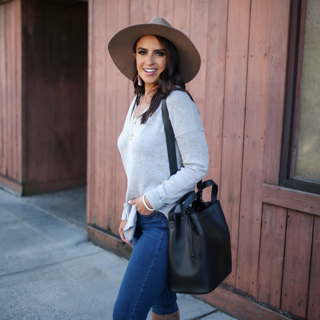 Blogger Sarah Lindner of The House of Sequins wearing Lole Martha Sweater and Skinny Long High Waisted Jeans