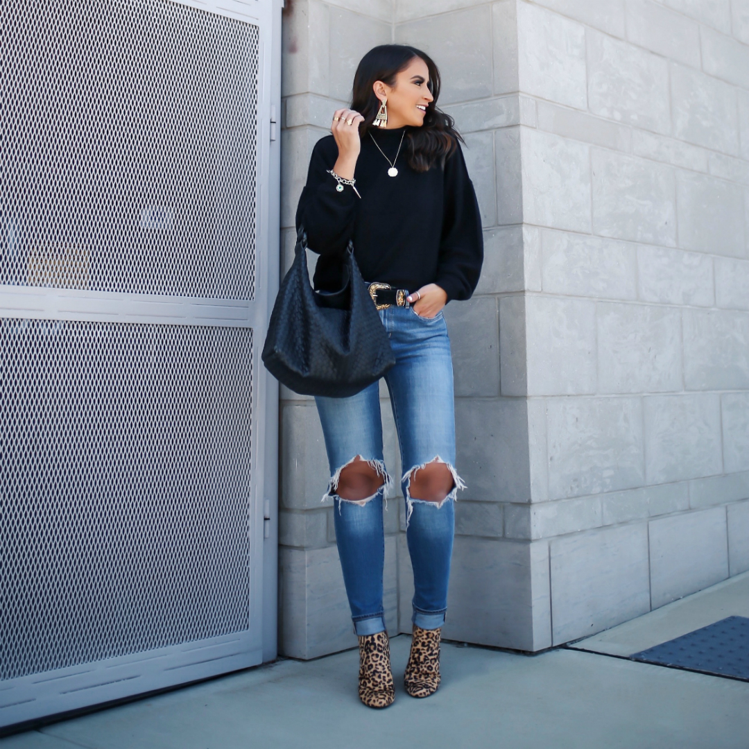 Blogger Sarah Lindner of The House of Sequins wearing Free People So Low So High cashmere sweater and Levi's 721 Ripped High Waist Skinny Jeans