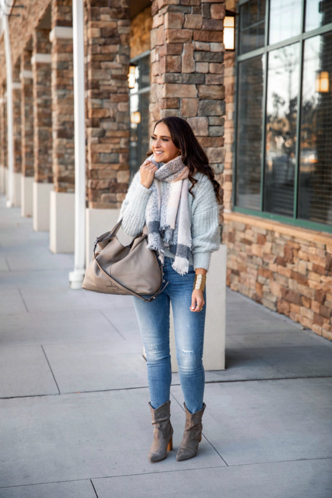 Blogger Sarah Lindner of The House of Sequins wearing fall outfit with mock neck sweater from Express.