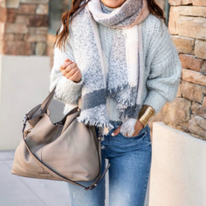 Blogger Sarah Lindner of The House of Sequins wearing fall outfit with mock neck sweater from Express.