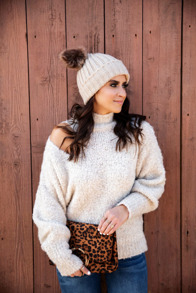 Blogger Sarah Lindner of The House of Sequins wearing cutout sweater from Express