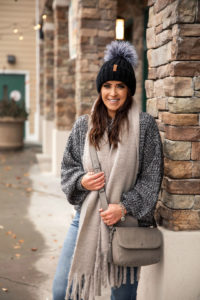 Blogger Sarah Lindner of The House of Sequins styling a fall outfit with chunky knits from Walmart