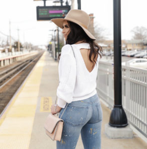 Blogger Sarah Lindner of The house of Sequins wearing white cut out sweater from express