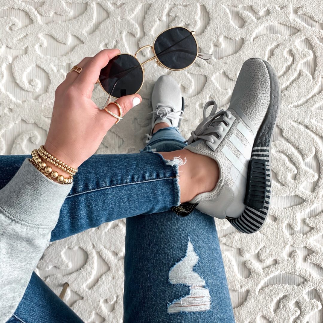 Blogger Sarah Lindner of The House of Sequins wearing trendy Adidas sneakers.