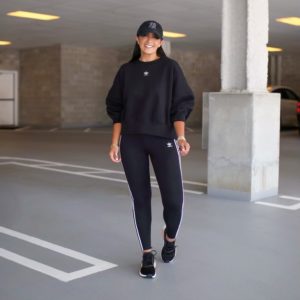 Blogger Sarah Lindner of The House of Sequins styling Adidas NMD R1 sneakers and athletic wear.